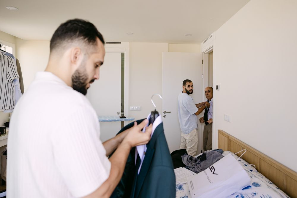 Groom preparing for wedding day in Oeiras