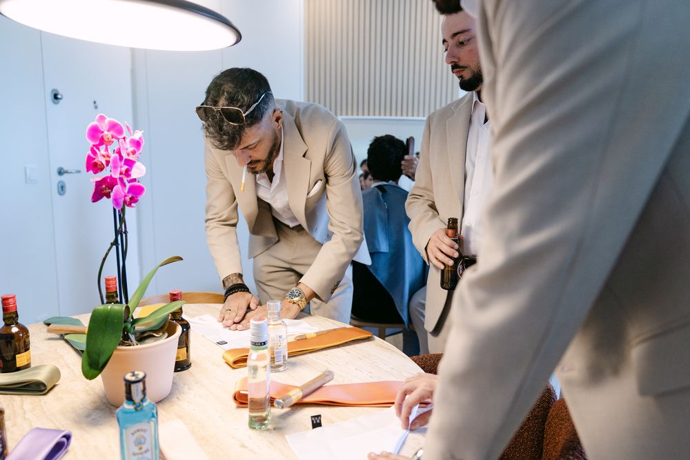 Groom with groomsmen during morning preparations