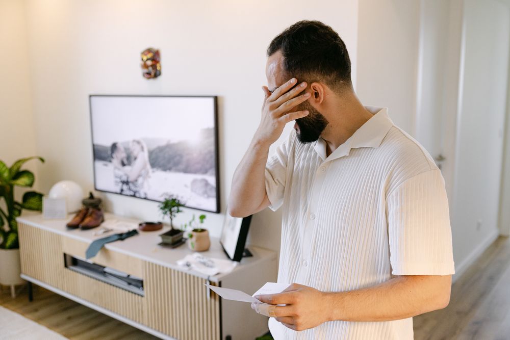 Groom reading letter from bride before ceremony