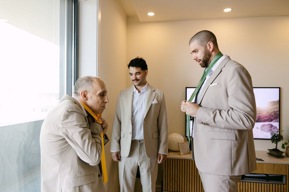 Father greeting groom before ceremony
