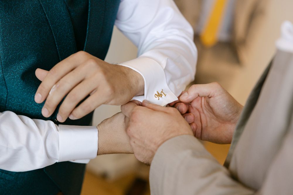 Groom getting ready at home before wedding ceremony