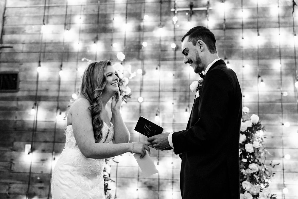 A romantic wedding photo series showing a couple in front of twinkling string lights and rustic decor.