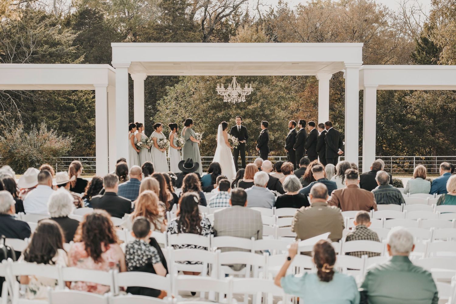 Guests watching bride enter spring wedding ceremony in Midlothian Texas