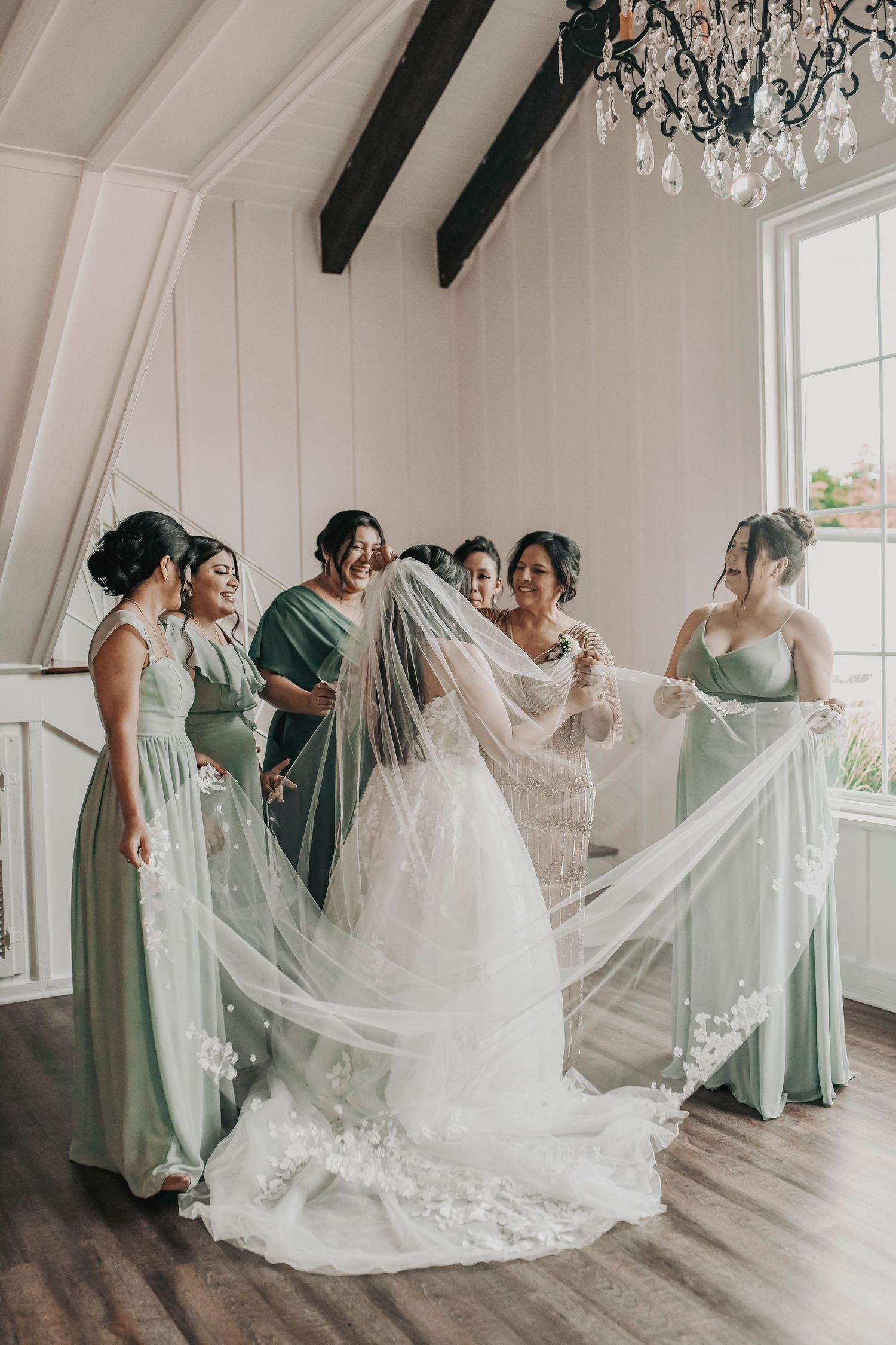 Bride getting ready in natural window light inside the Firefly Gardens bridal suite