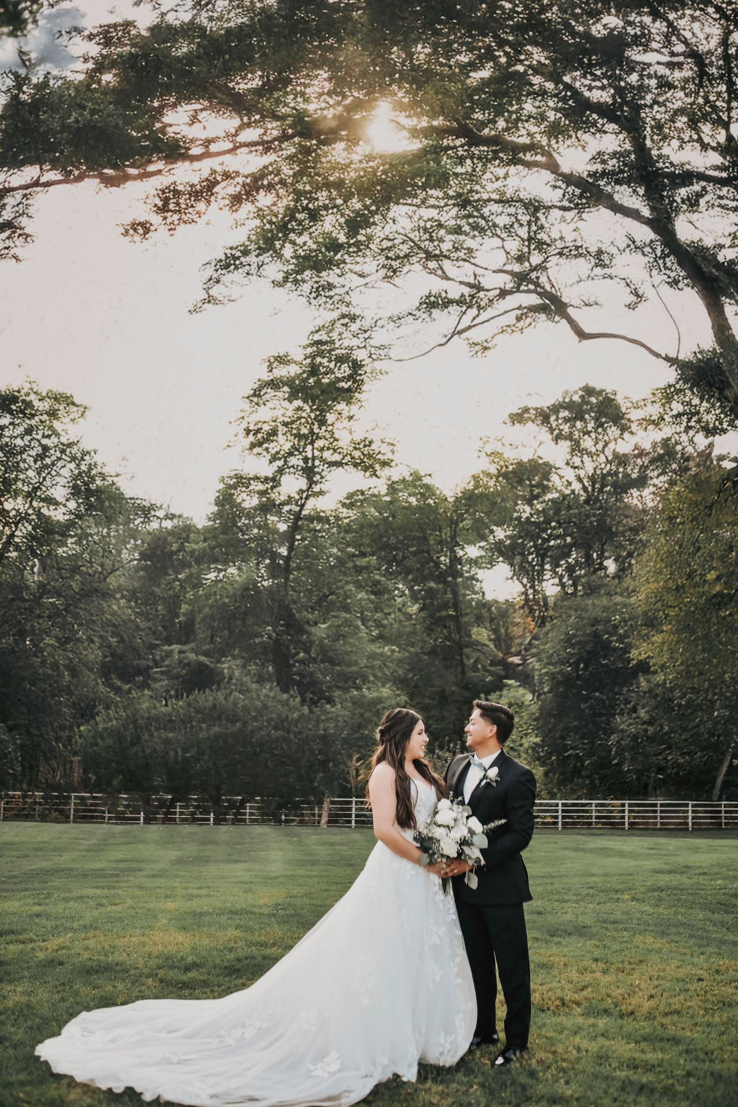 Elegant black tie couple portrait in natural spring light
