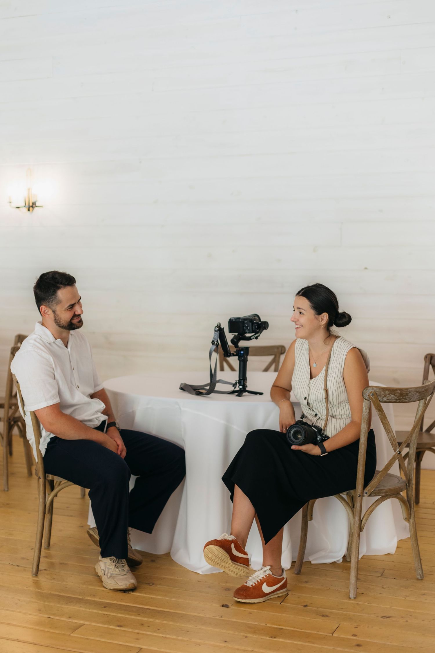 Documentary style wedding photographer and videographer smiling