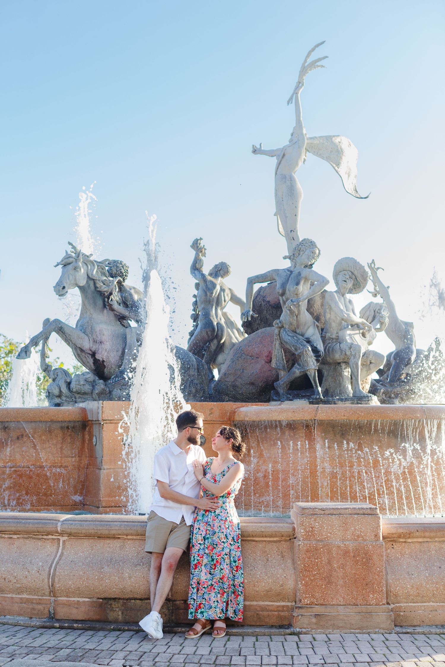 Couples portrait. Marriage proposal at Fuente Raíces in Old San Juan, Puerto Rico.