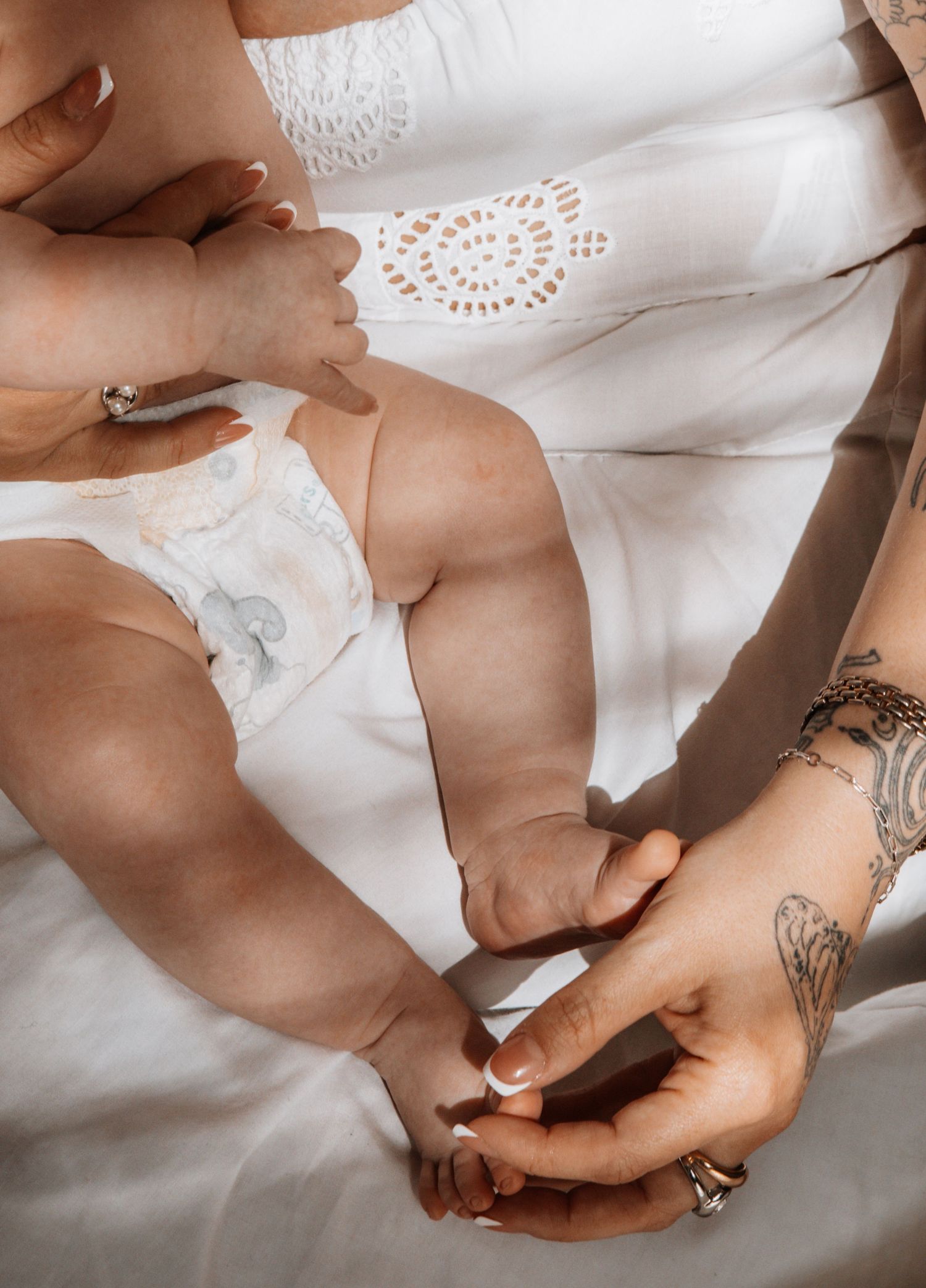 Close-up view of hands, mommy and baby.