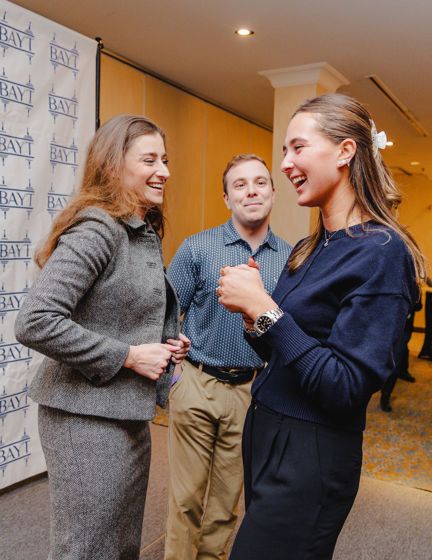 A series of candid photos showing people laughing and interacting at a business or networking event.