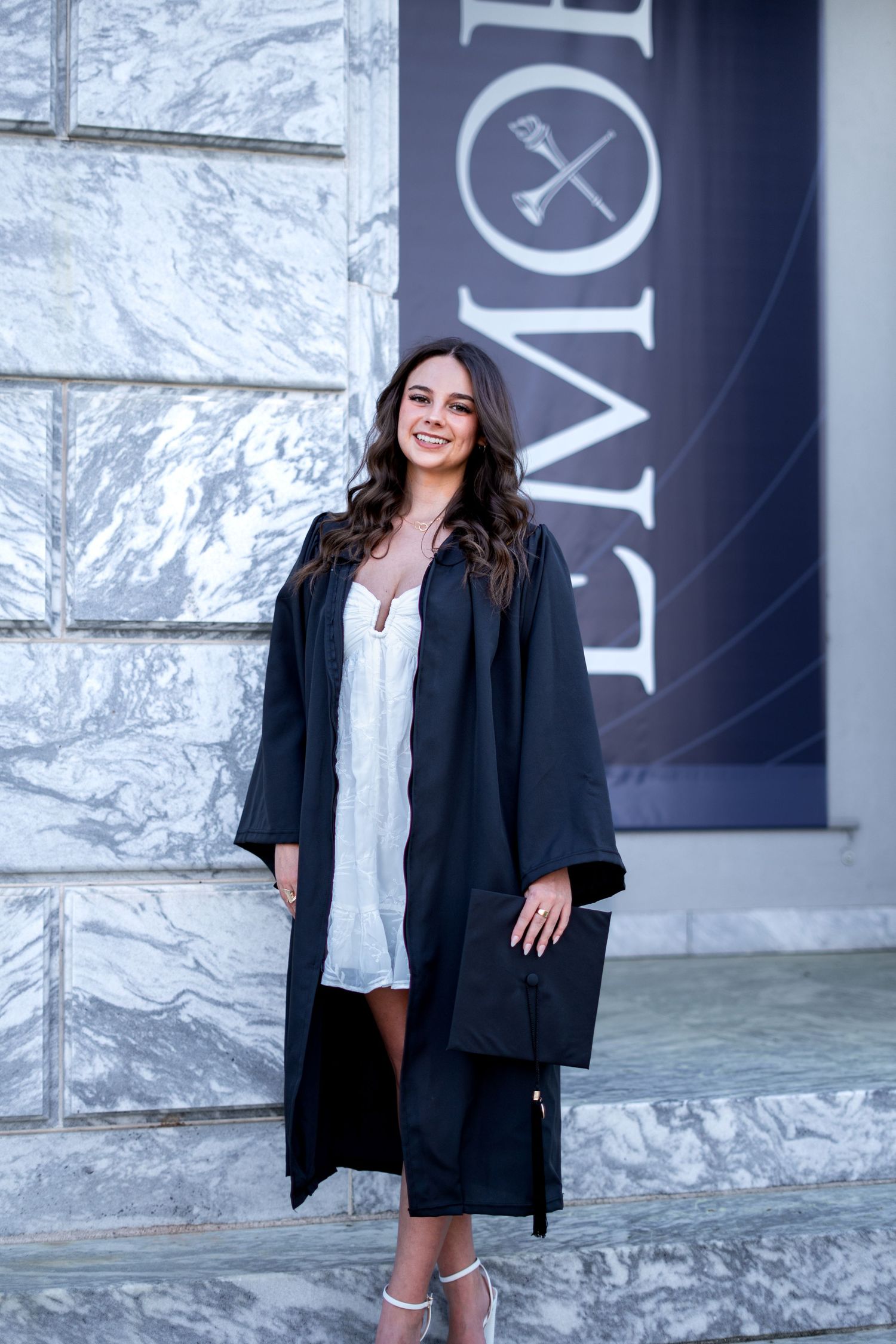 Emory graduation photos at emory banner DEI office steps by Pierre, Atlanta Graduation Photographer