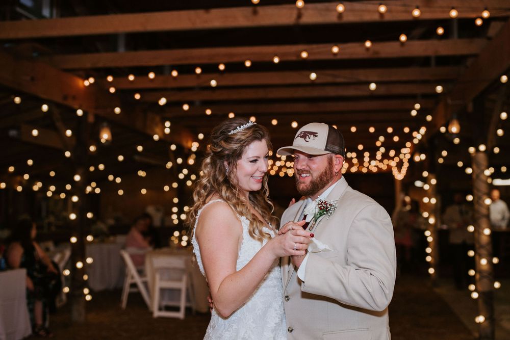 Wedding reception venue decorated with romantic string lights creating a warm ambiance.