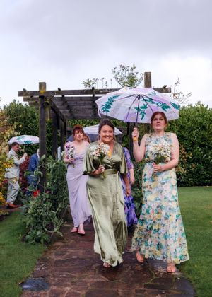 non-traditional wedding photographer in the Lake District - rainy bridesmaid exit