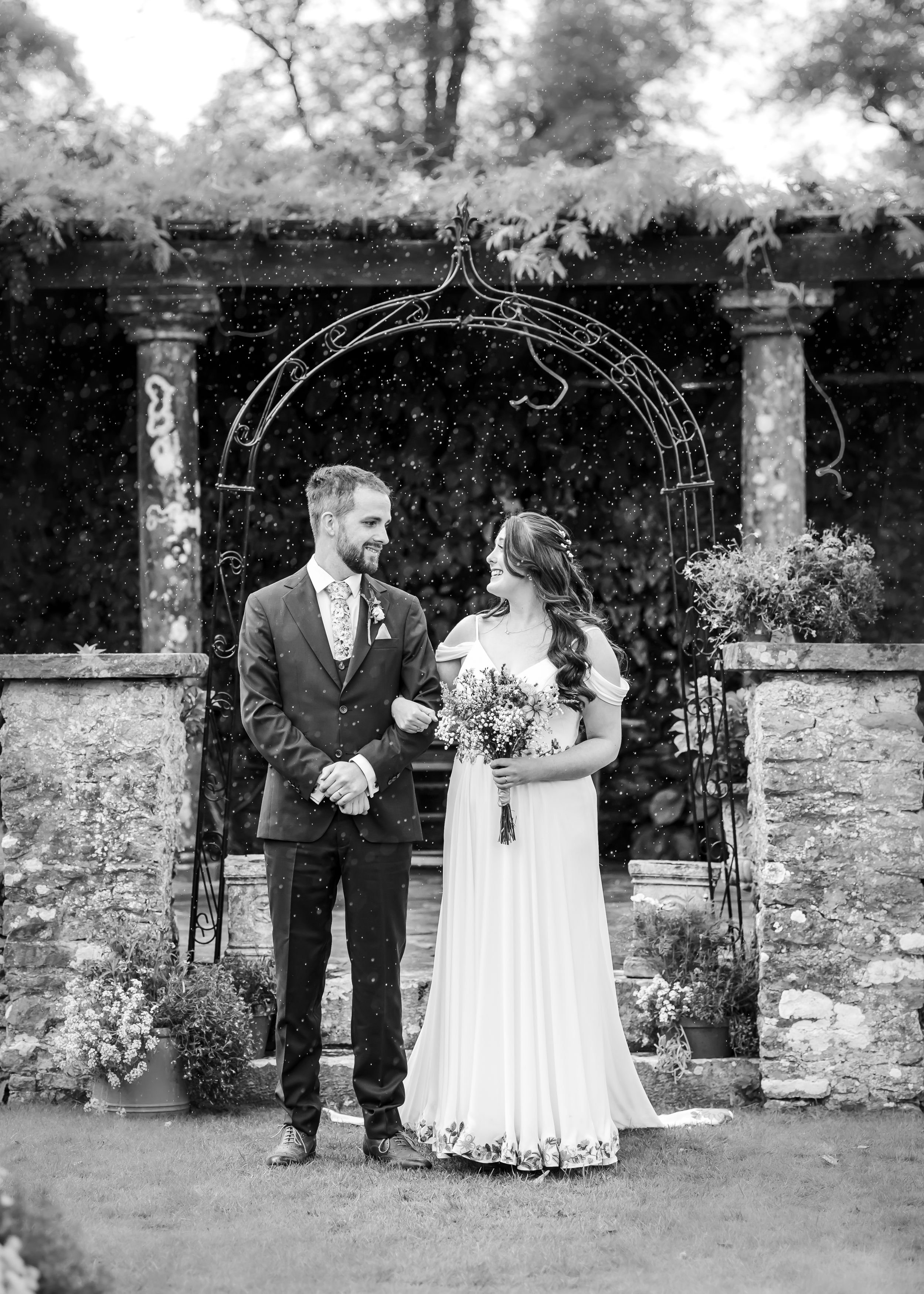 non-traditional wedding photographer in the Lake District - bride and groom rainy exit