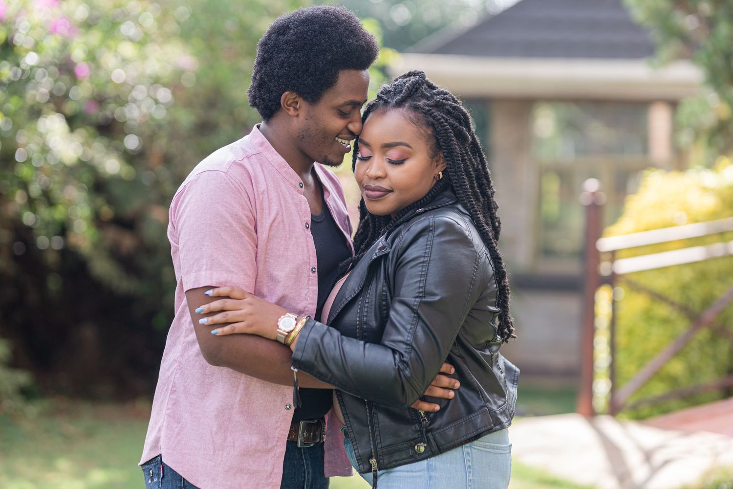 Stunning portraits of a couple, they're hugging. She has her eyes closed. He's nuzzling her hair. Ikigu George Photography.