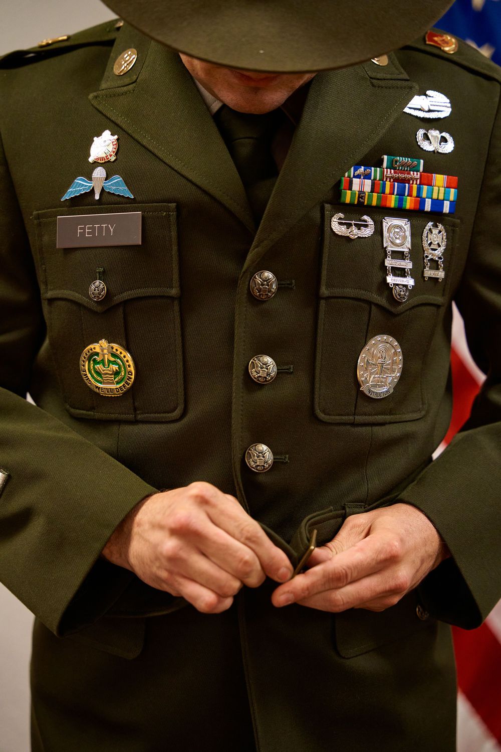 Close-up of military dress uniform showing medals, badges and decorations.