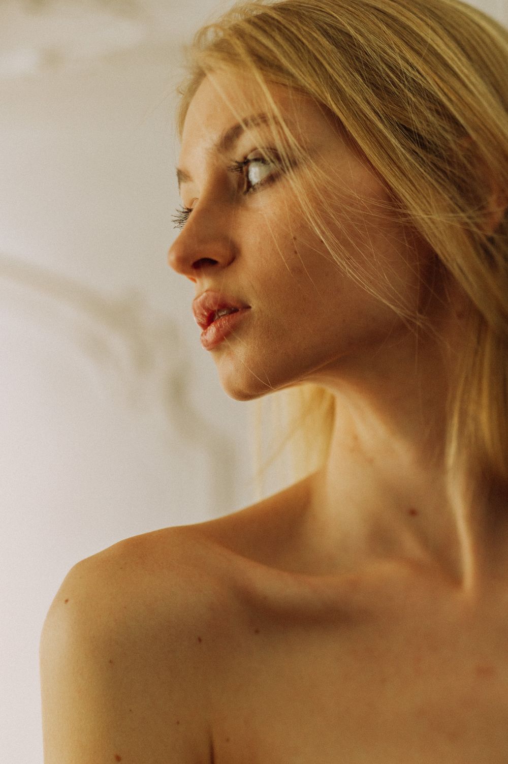 Artistic profile portraits showing soft lighting and natural expressions.