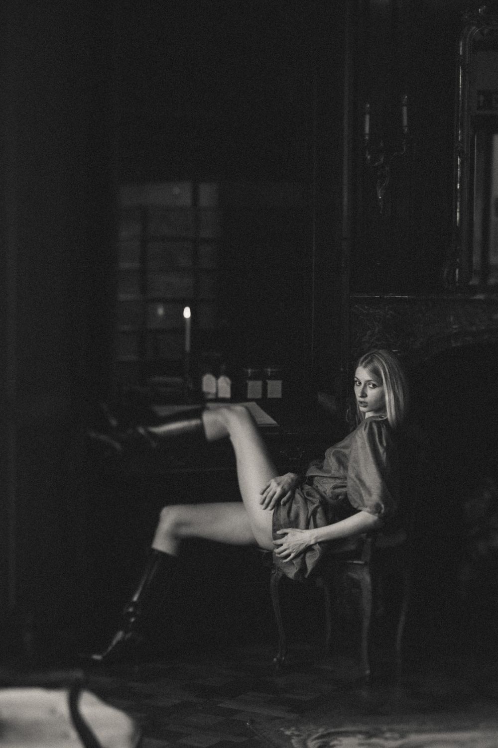 Dark moody black and white photos capturing movement and form in a shadowy space.