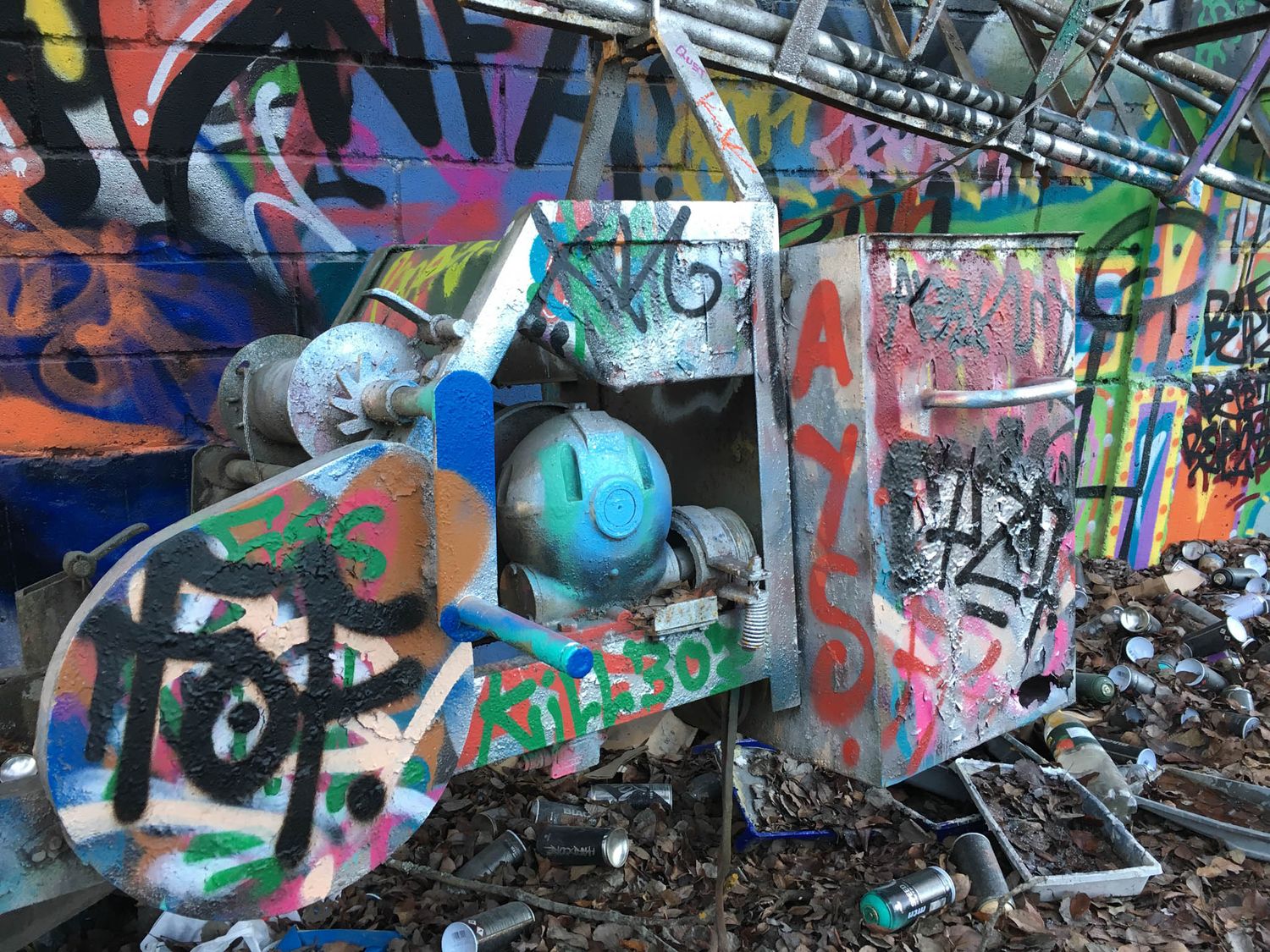 Lots of graffiti on a wall.