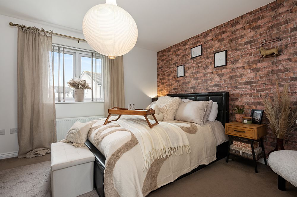 Master bedroom with brick wall effect and king size bed. Photographed for interior designer.