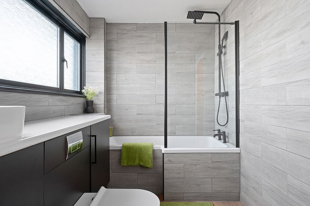 Newly refurbished family bathroom with grey and black styling. Falkirk estate agents.
