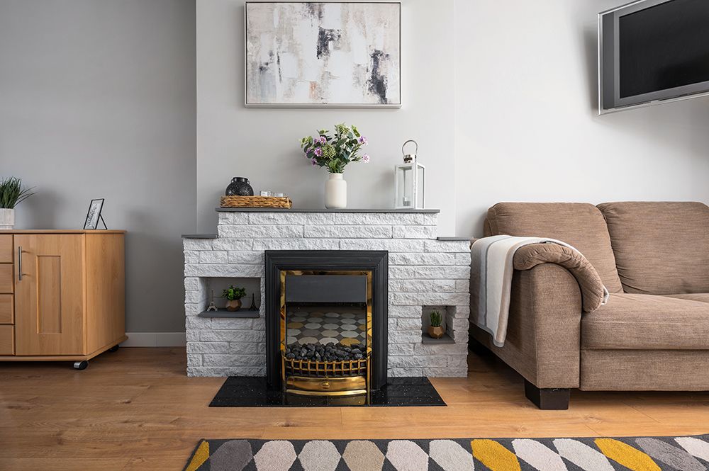 Large lounge with log burner fire. Falkirk property photographed for Airbnb host.