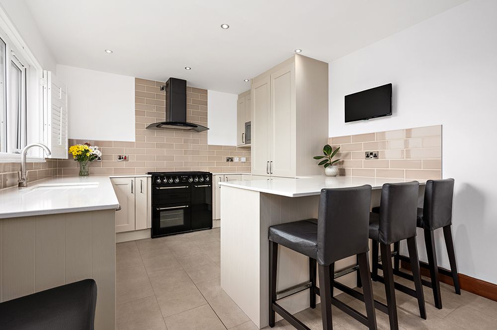 Minimal and modern kitchen with breakfast bar. Interior photography for dunfermline estate agent.