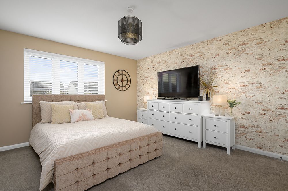 extensive master bedroom with kingsize bed and large white dresser. Photographed for a fife estate agent.