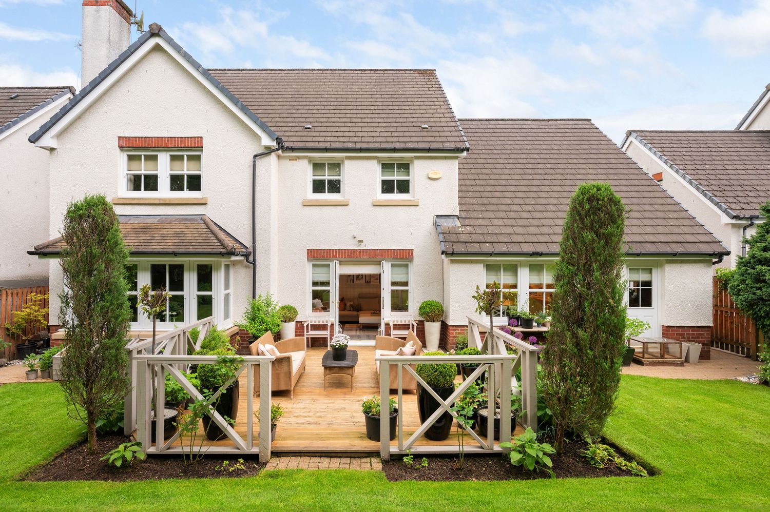 Exterior property photography of landscaped rear garden of extensive detached home near stirling.