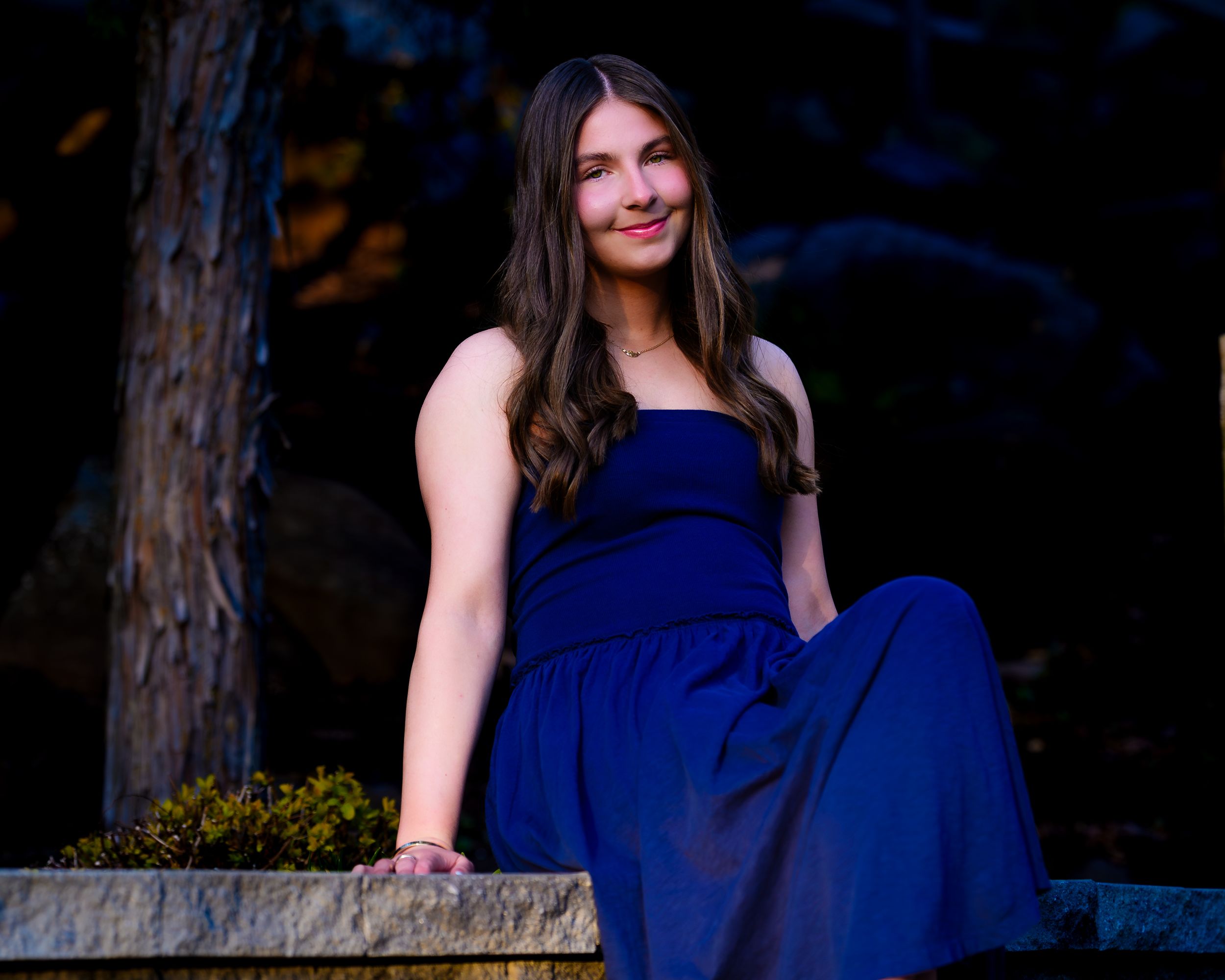 High School senior portrait seated outdoors at night, by Deanna Fox, SportsFox Photography, Hershey PA