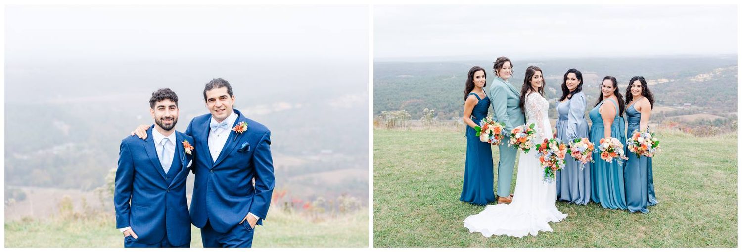 Wedding party in coordinated blue attire gathered on mountaintop with scenic views.
