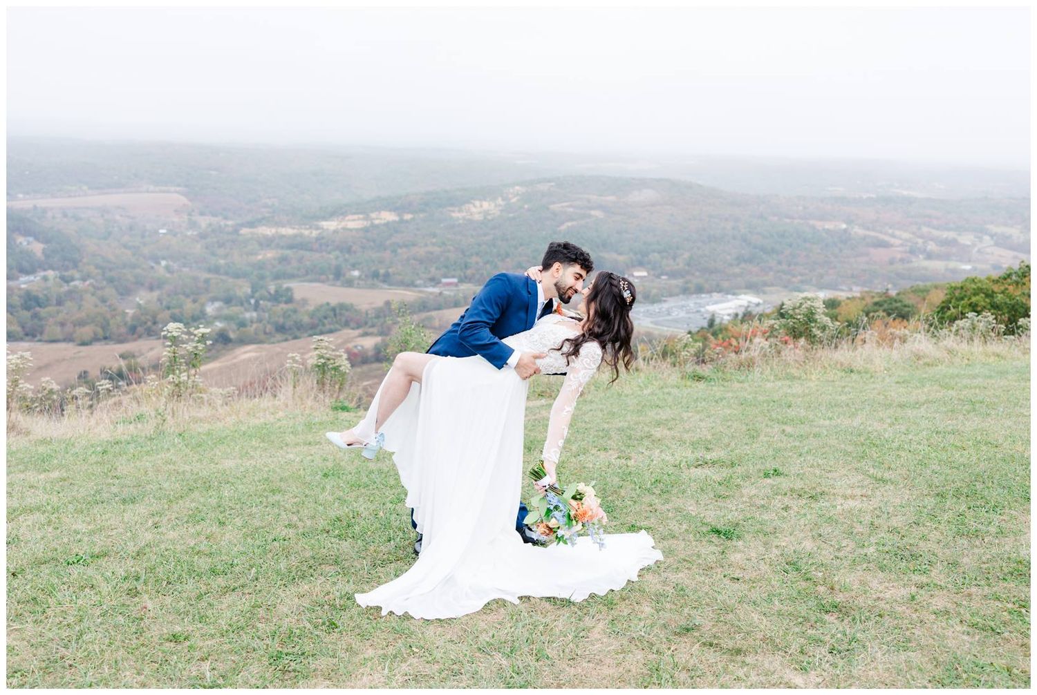 Romantic wedding portraits captured on a scenic mountain overlook during autumn.