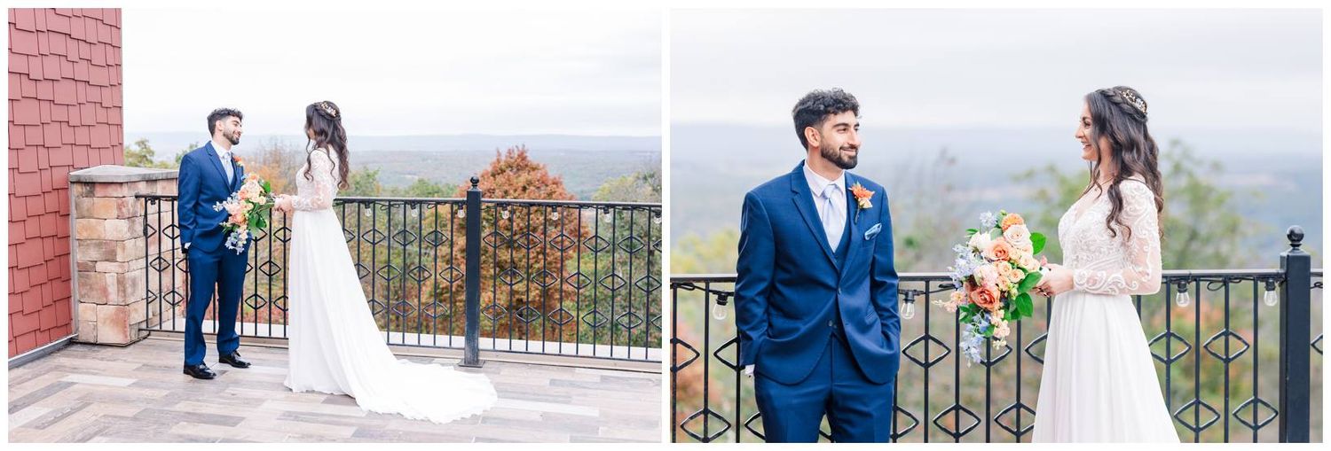 Wedding couple and bridal party pose on scenic mountain overlook with iron railing and autumn landscape.