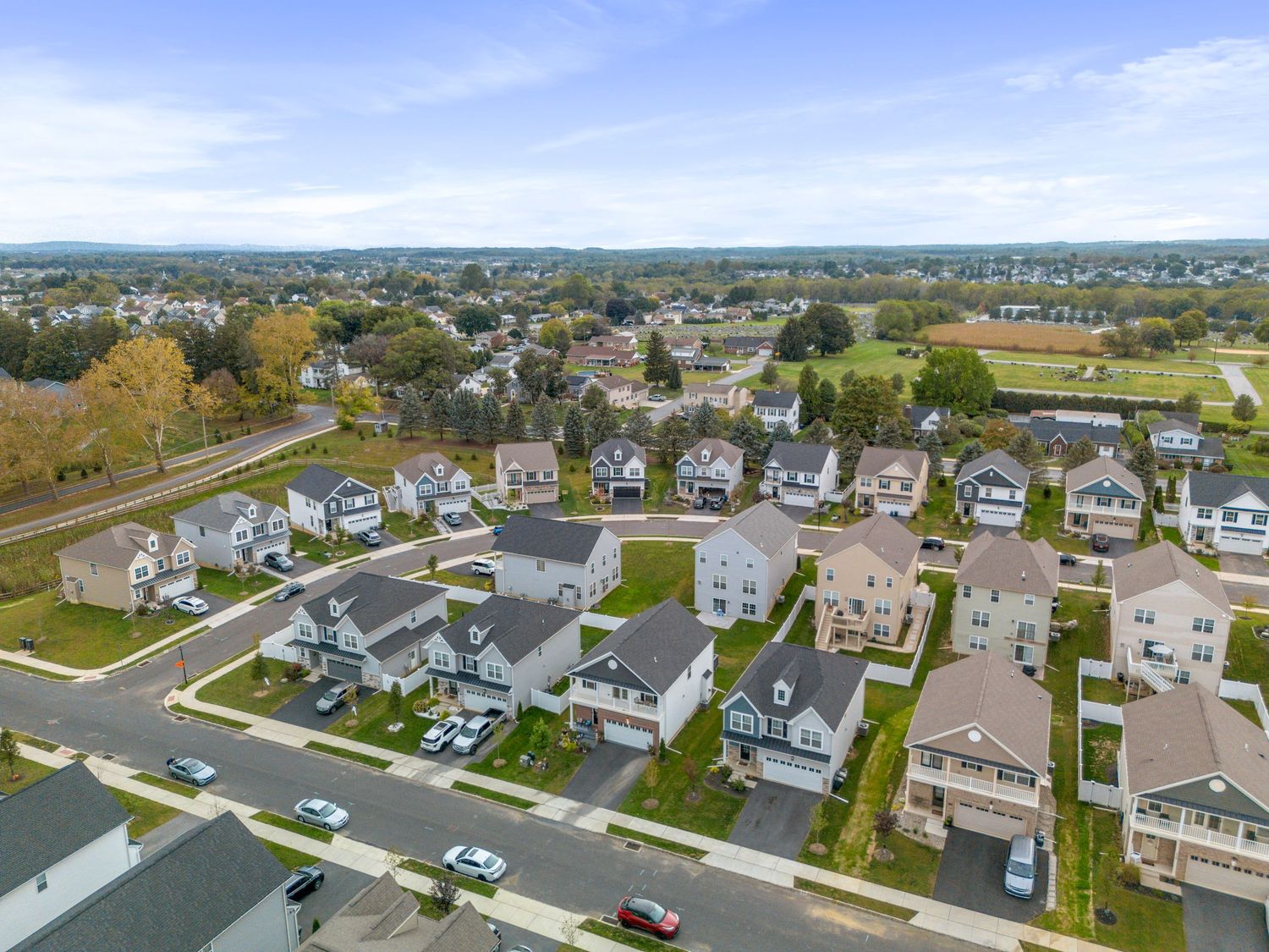 Aerial view of suburban development showing curved streets and residential housing patterns.