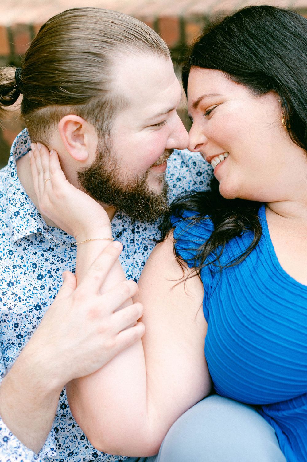 A romantic couple shares intimate moments in a series of close-up photos showing tender expressions.