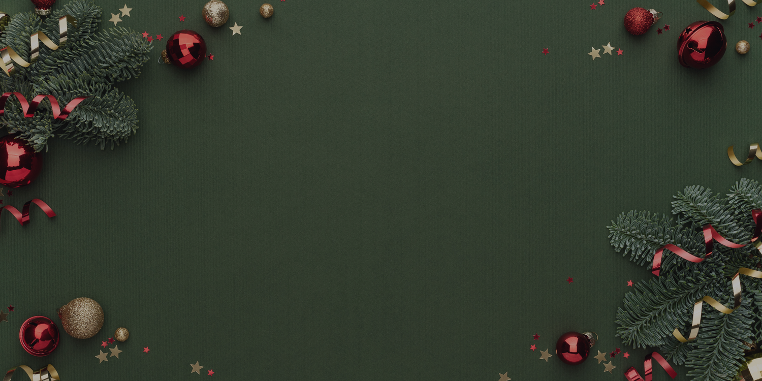 Festive Christmas ornaments and pine branches scattered on dark green background creating a holiday border design.