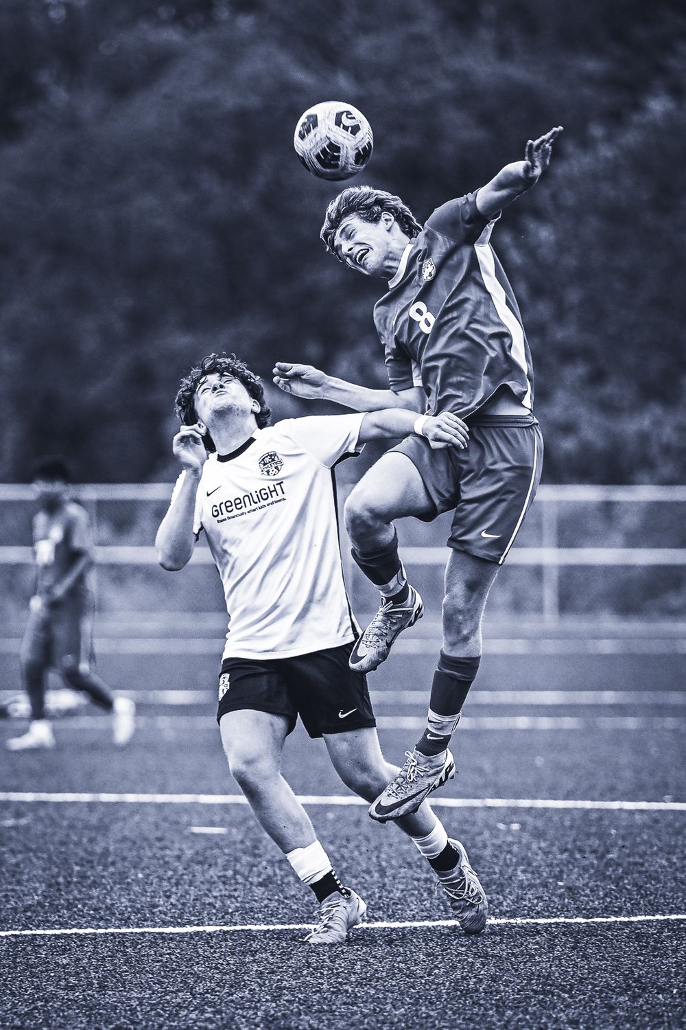Black and white sequence of action photos showing soccer players competing for ball control during an intense match.