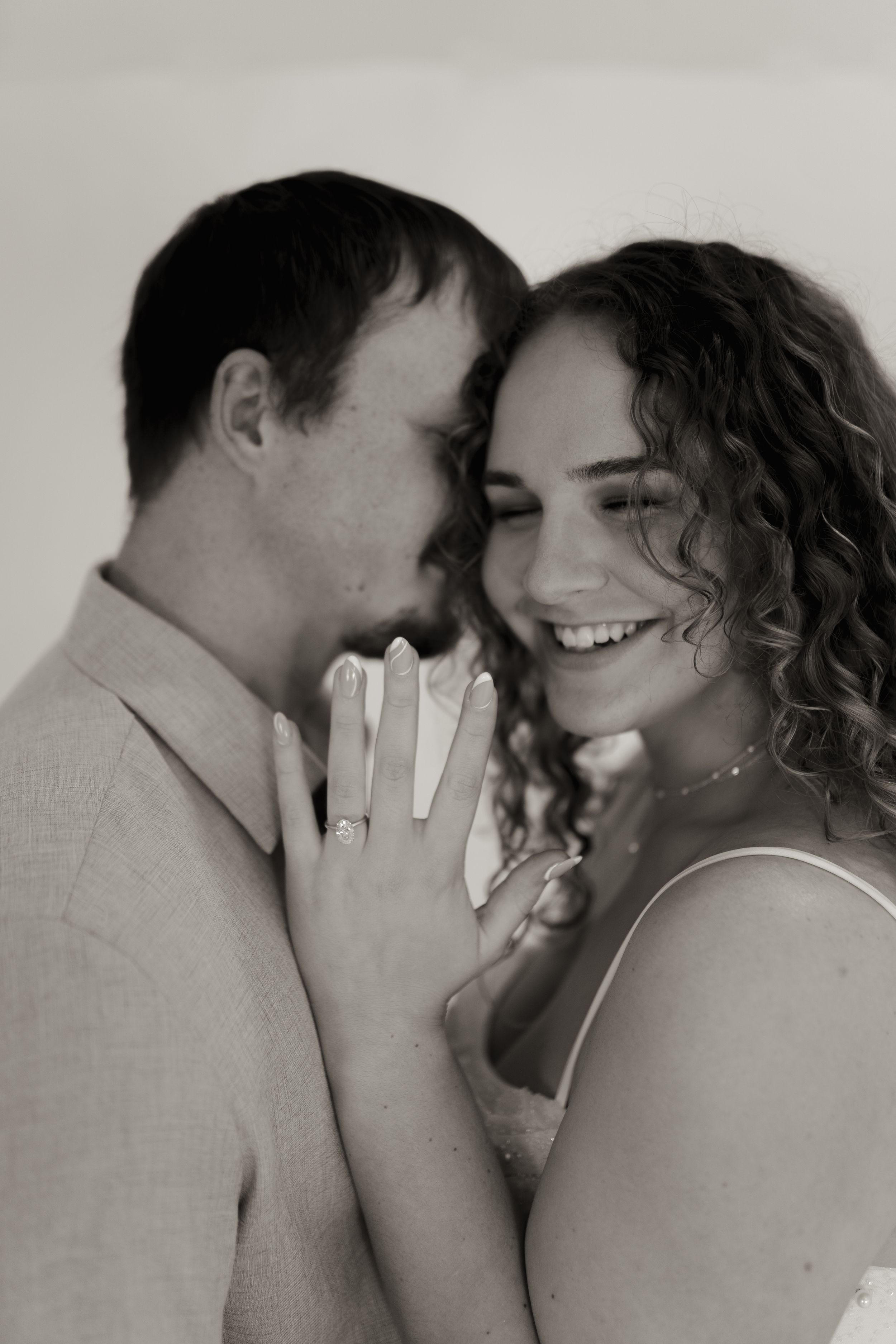 Intimate portrait series showing genuine laughter and connection between couple.