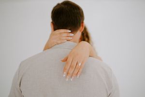 Close-up shots focusing on hands and physical connection between couple.