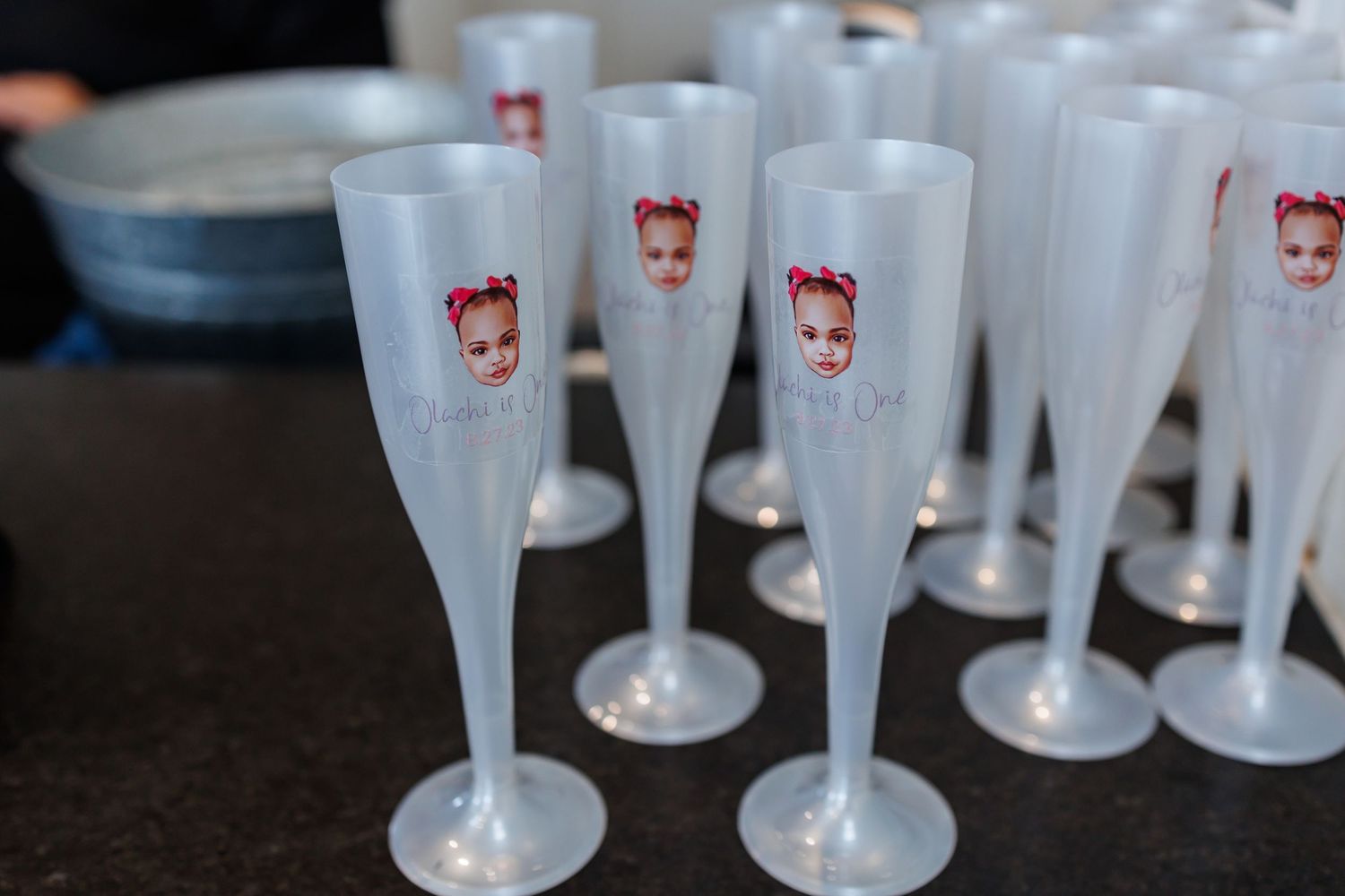 Frosted champagne flutes custom printed with the birthday baby's face at a birthday party at Bella Cavalli