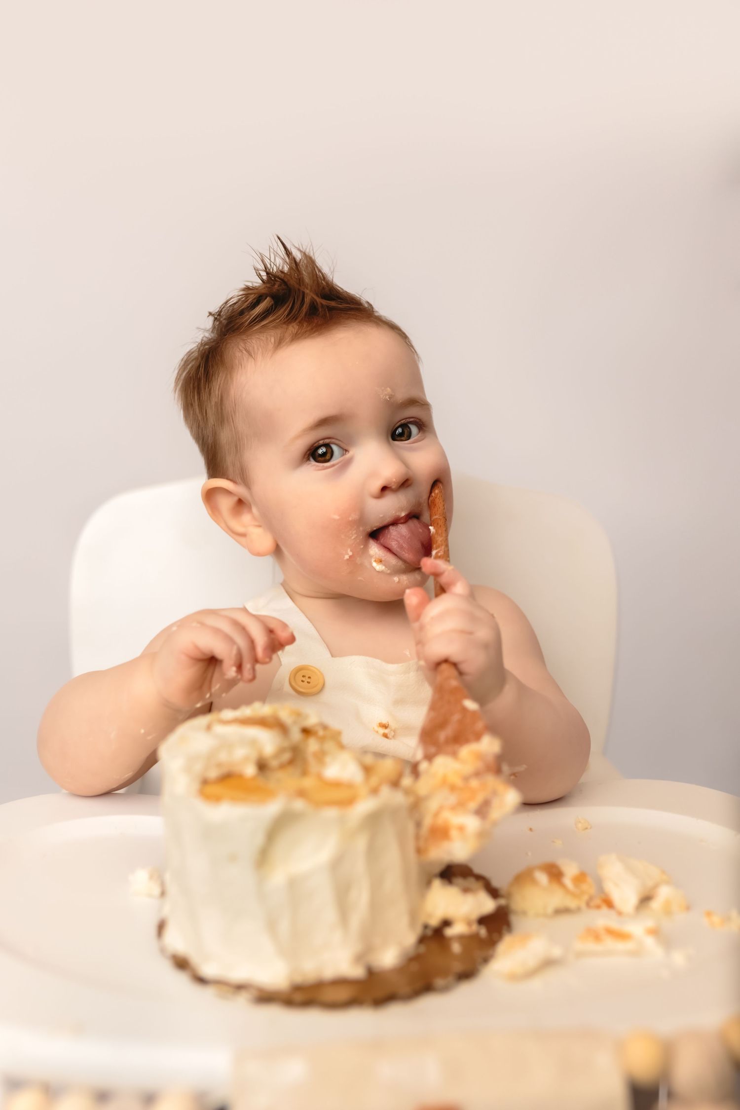 Somerset Portraits cake smash session with baby boy using wooden spoon and neutral decor for first birthday in Charlottesville