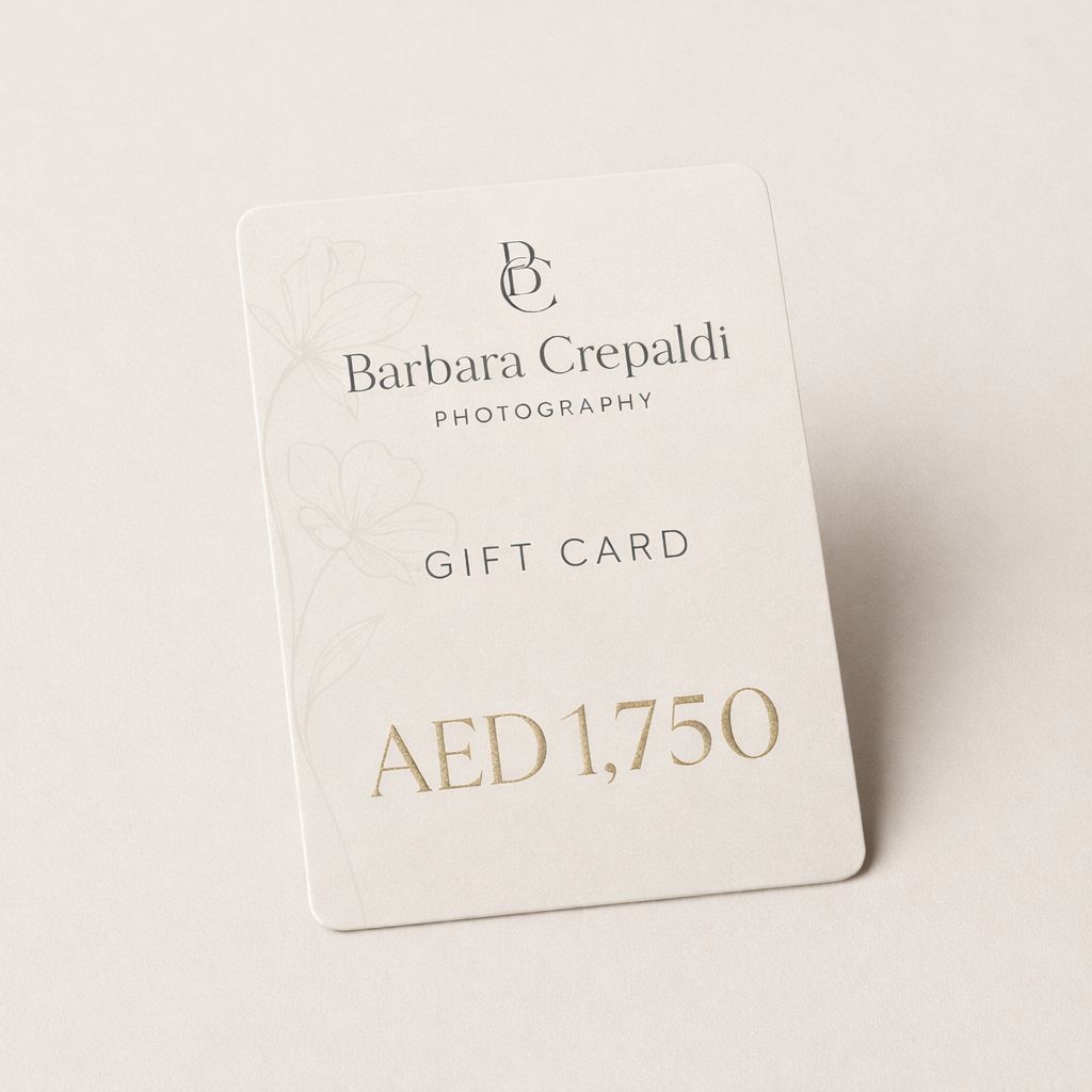 Elegant white photography gift card showing AED 1,500 value with Barbara Crepaldi branding in minimal design.