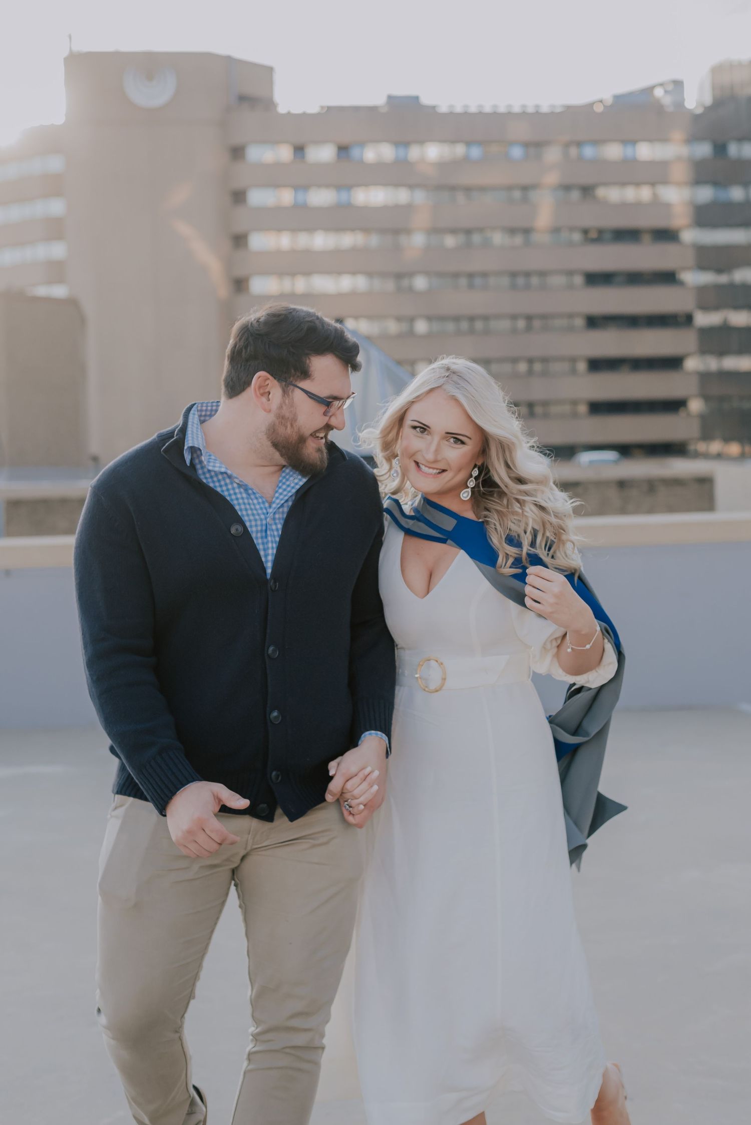 A couple enjoying a romantic moment together on an urban rooftop.