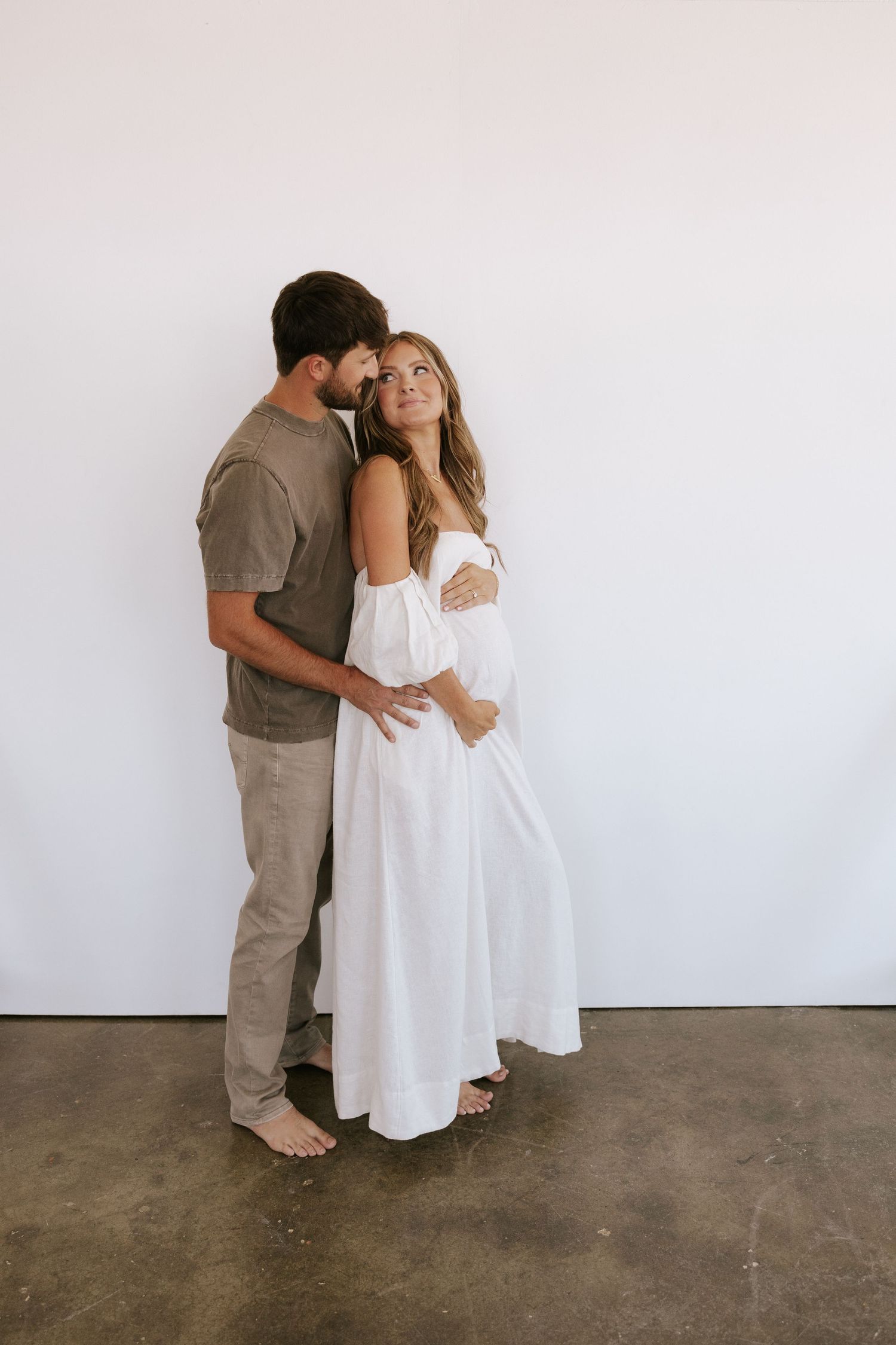 Kansas City Photographer with couple in studio for maternity photos