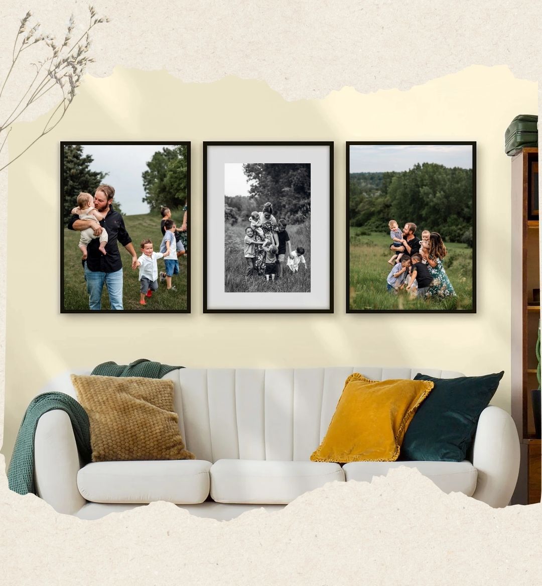 Three framed family photographs displayed above a white couch with yellow and green accent pillows.