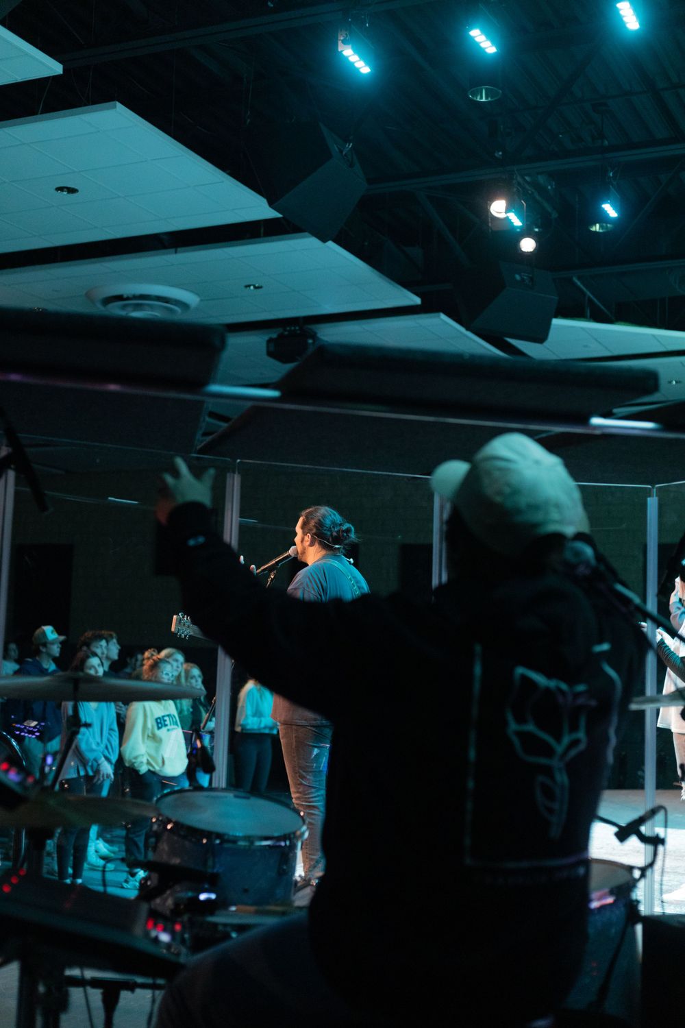 Shot of drummer praising god at a worship night at Artisan Church