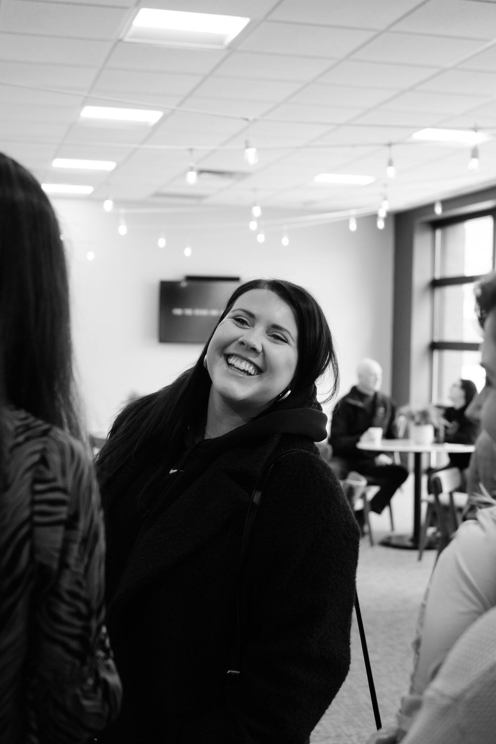 Lobby moments in black and white at Artisan Church in Blaine Minnesota
