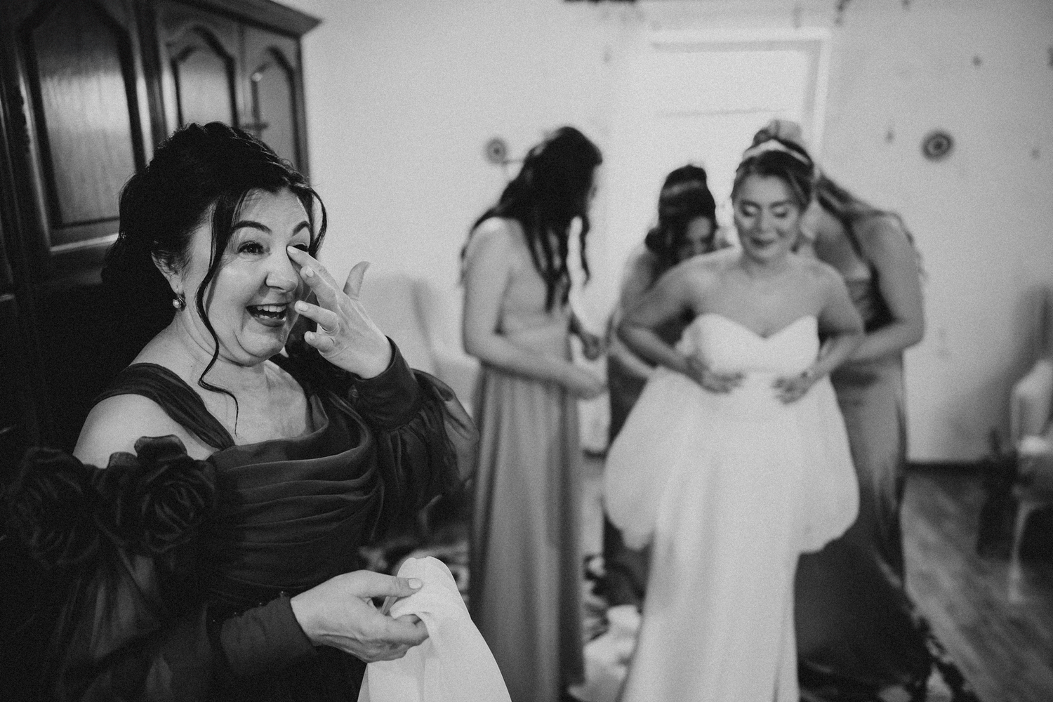 Candid black and white photos capture pre-wedding celebration moments with bridal party.