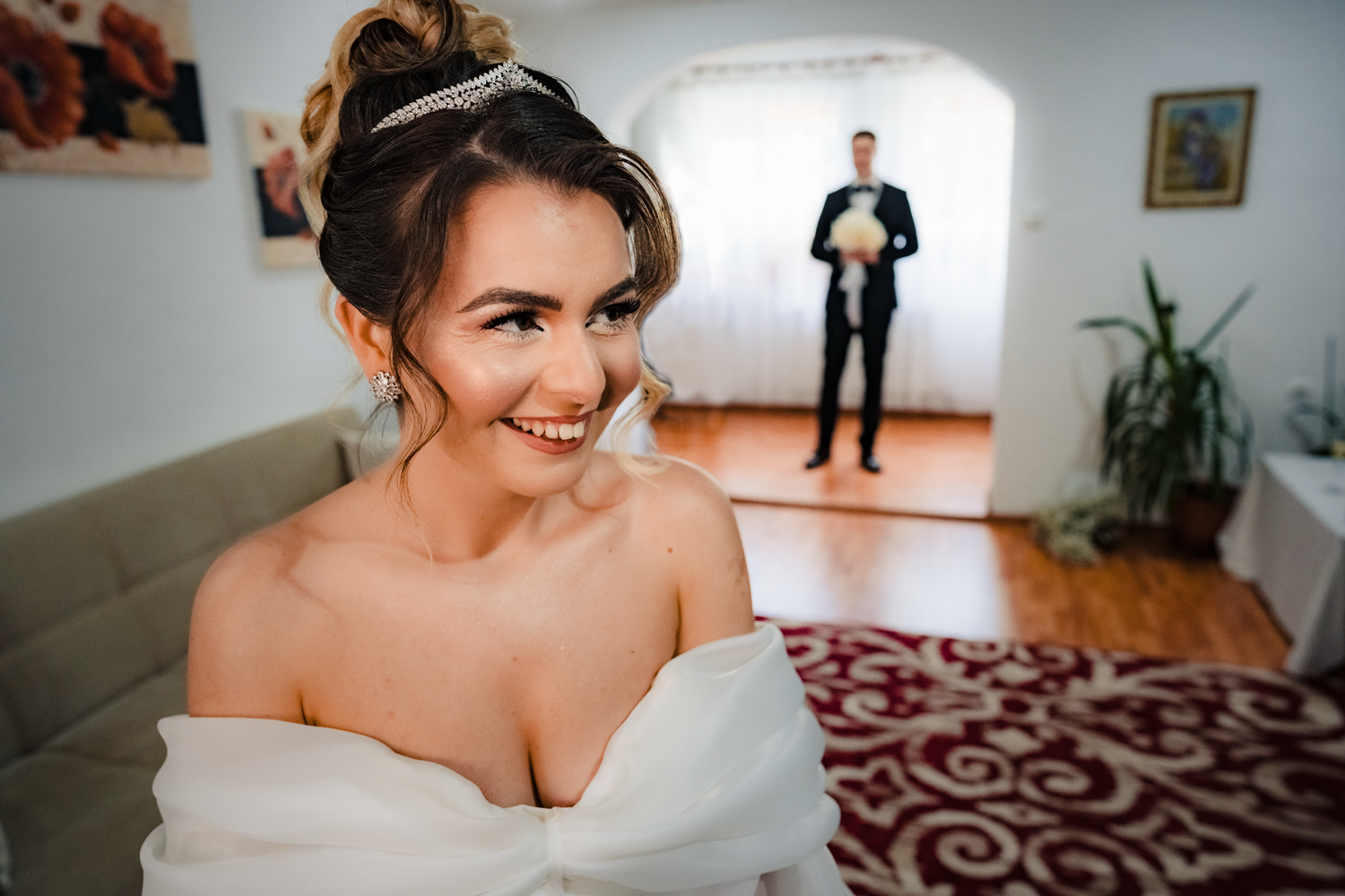 Candid pre-wedding moments captured in bright interior setting.