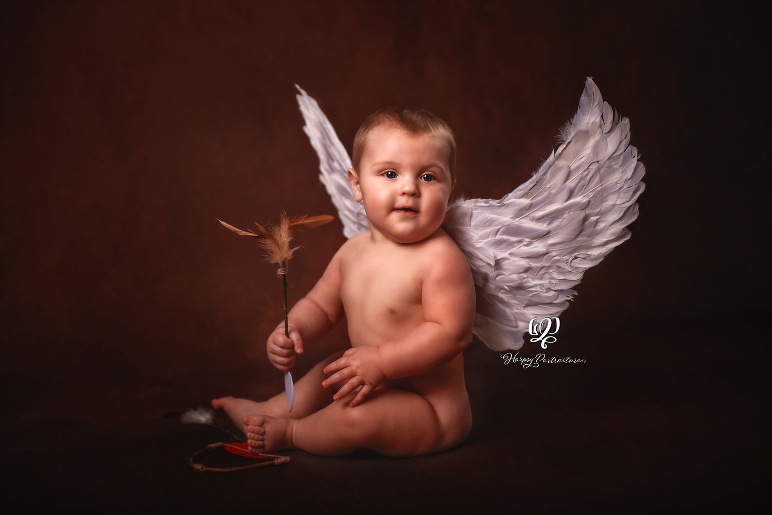 Artistic fine art photo baby cupid; baby holding bow & arrows wearing cupid wings in fine art children's photoshoot Lexington, SC