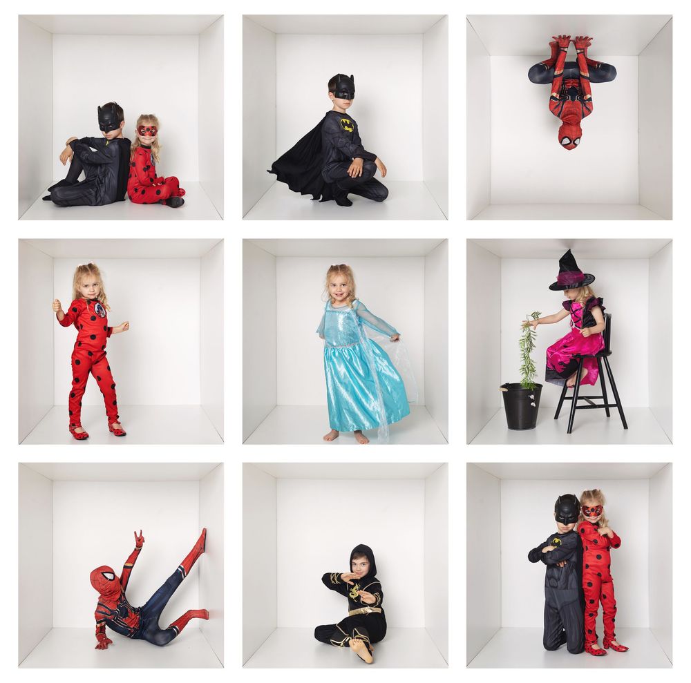 Nine children in superhero and fantasy costumes posed individually in white cube shelves, including Spider-Man, Elsa, and witch outfits.